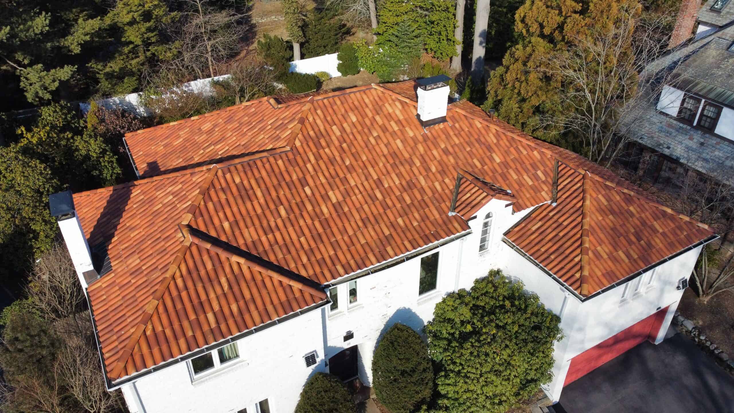 an aerial view of a house with a red roof.