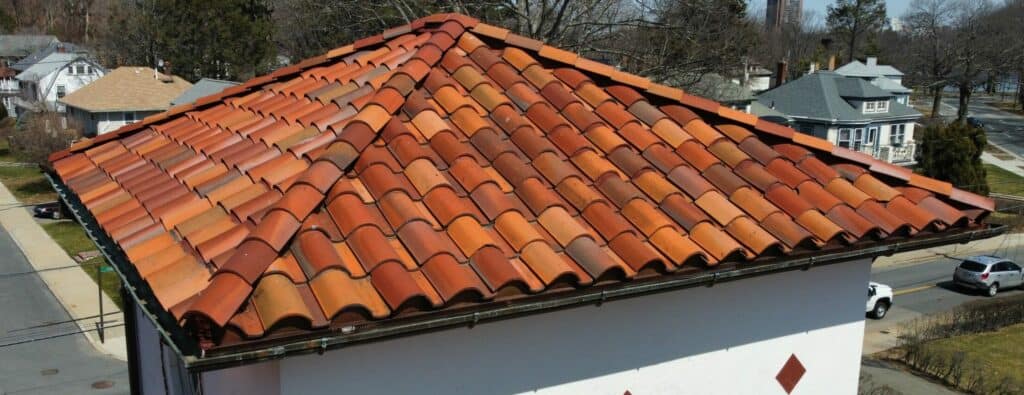 an aerial view of a red tile roof.