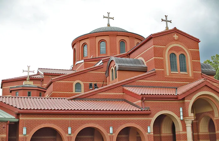 a red brick church with a large dome on top.